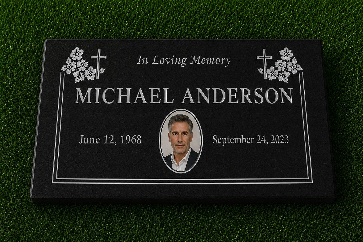 Jet Black granite memorial marker with engraved crosses, flowers, and a porcelain photo, set in grass